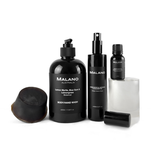 A gift pack containing various Malano branded products including a soap block, body wash, hand wash, and essential oil, with a Lemon Myrtle scent, displayed against a white background.