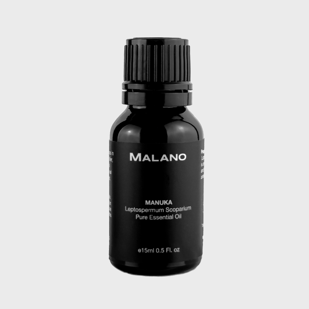 A 15mL bottle of MALANO Manuka Pure Essential Oil with a black label and white writing.