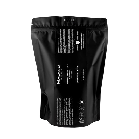 A black refill bag  labeled 'Malano Body/Hand Wash with the scent of Lavender. Tobacco Leaf and Cinnamon sitting against a white background with a capacity of 500mL