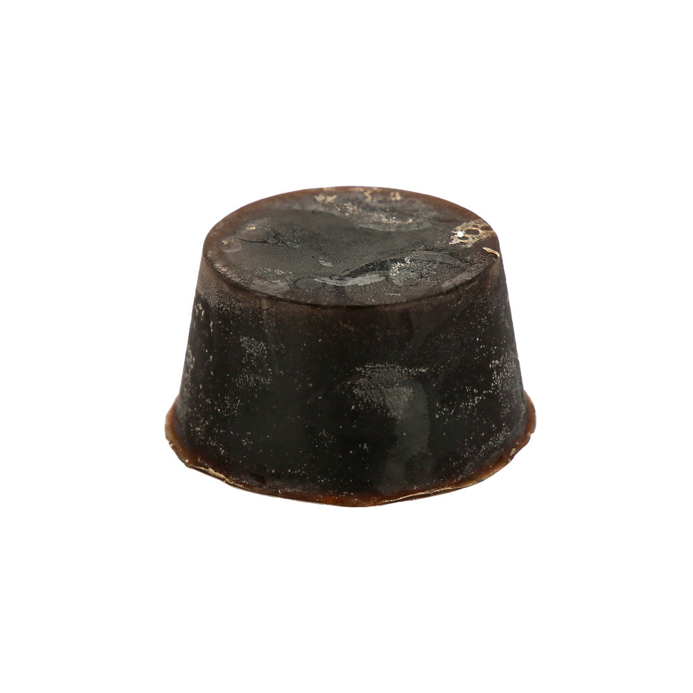 A round and dark brown coloured, 50 Shades of Tasmania scented Organic Soap Block with Shea Butter and Cupuacu Butter