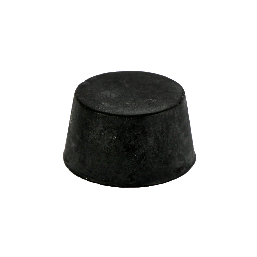 A round black organic block of Black Kraken Rum Soap Block containing Activated Charcoal and Kraken Rum against a white background.