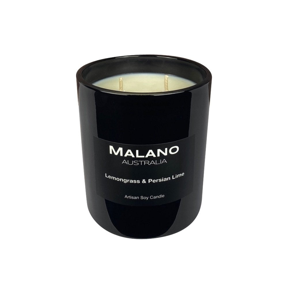 Luxury black glass soy candle by Malano with two wicks, featuring a rich fragrance blend of Lemongrass and Persian Lime and sitting against a white background. Hand-poured artisan candle for home fragrance and relaxation.