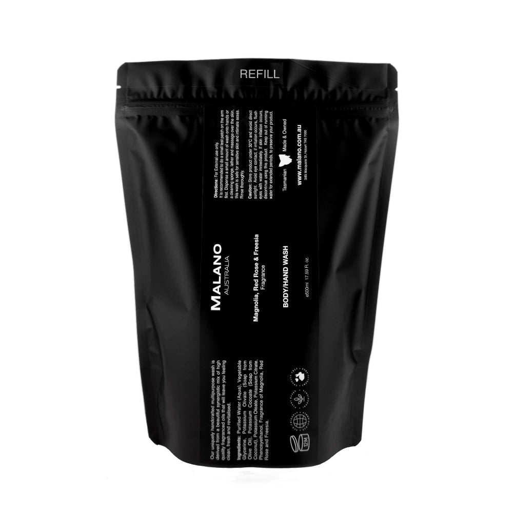 A black refill bag labeled 'Malano nBody/Hand Wash with the scent of Basil, Mandarin, and Cyclamen sitting against a white background with a capacituy of 500mL