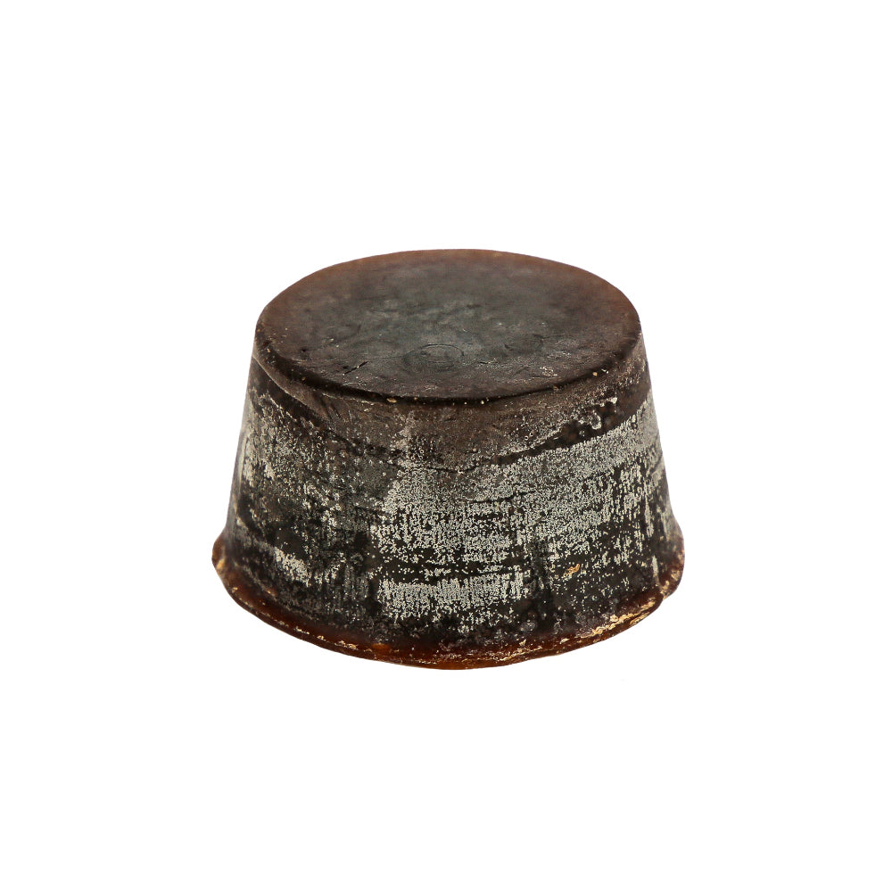 Organic round Summer Fruits Soap Block with Nectarine, Peach, White Grapefruit, Lime, Petitgrain, Musk and Vanilla. Dark brown block sitting against a white backgroud.