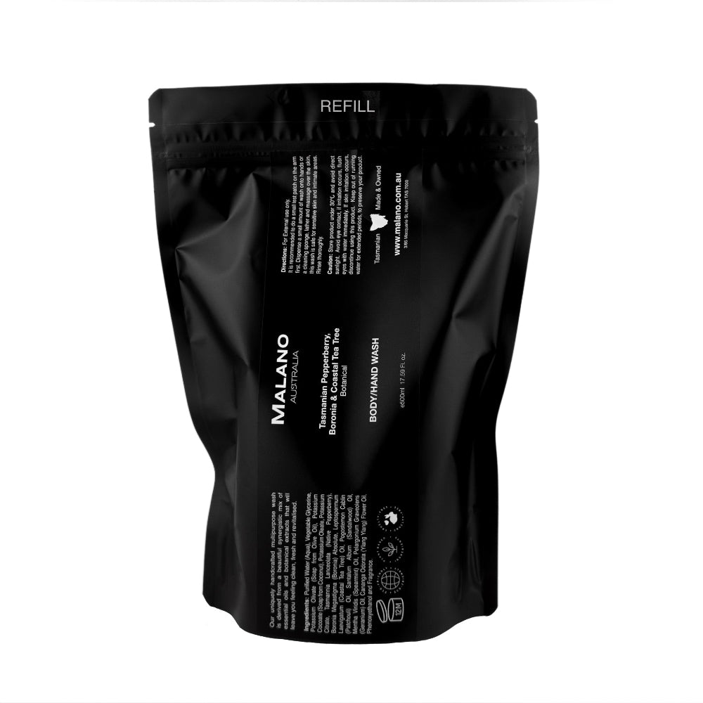 A black refill bag labeled 'Malano Body/Hand Wash with the scent of Tasmanian Pepperberry, Boronia and Costal Tea Tree, in 500mL, sitting against a white background.