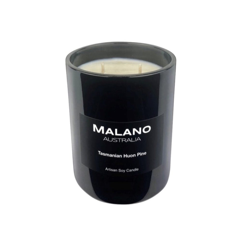 Black gloss glass jar containing a luxury Australian artisan hand poured scented soy wax candle by Malano with a woody, fougère scent of Tasmanian Huon Pine, sitting against a white background