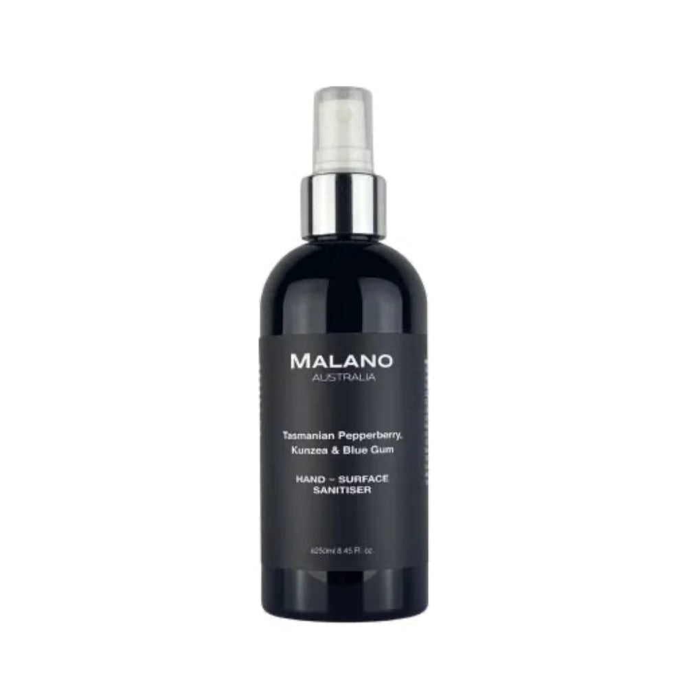 A little black bottle with a silver and white spray nozzle, a clear lid, and with a black label and white writing that reads ‘Malano, Tasmanian Pepperberry, Kunzea and Blue Gum, Hand-Surface Sanitiser’ with a capacity of 250mL, the bottle is sitting against a white background