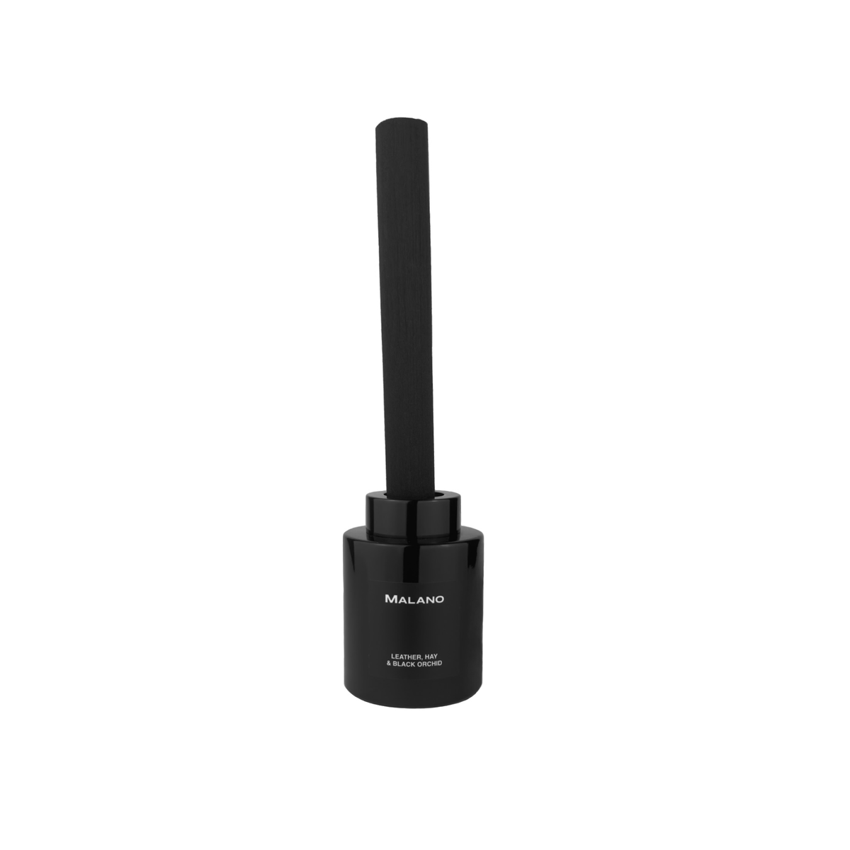 A black reed diffuser with 1 ultra thick long reed inserted into a black cylindrical glass container with a label of the brand ‘Malano’ and the scent ‘Leather, Hay and Black Orchid’ on the front.
