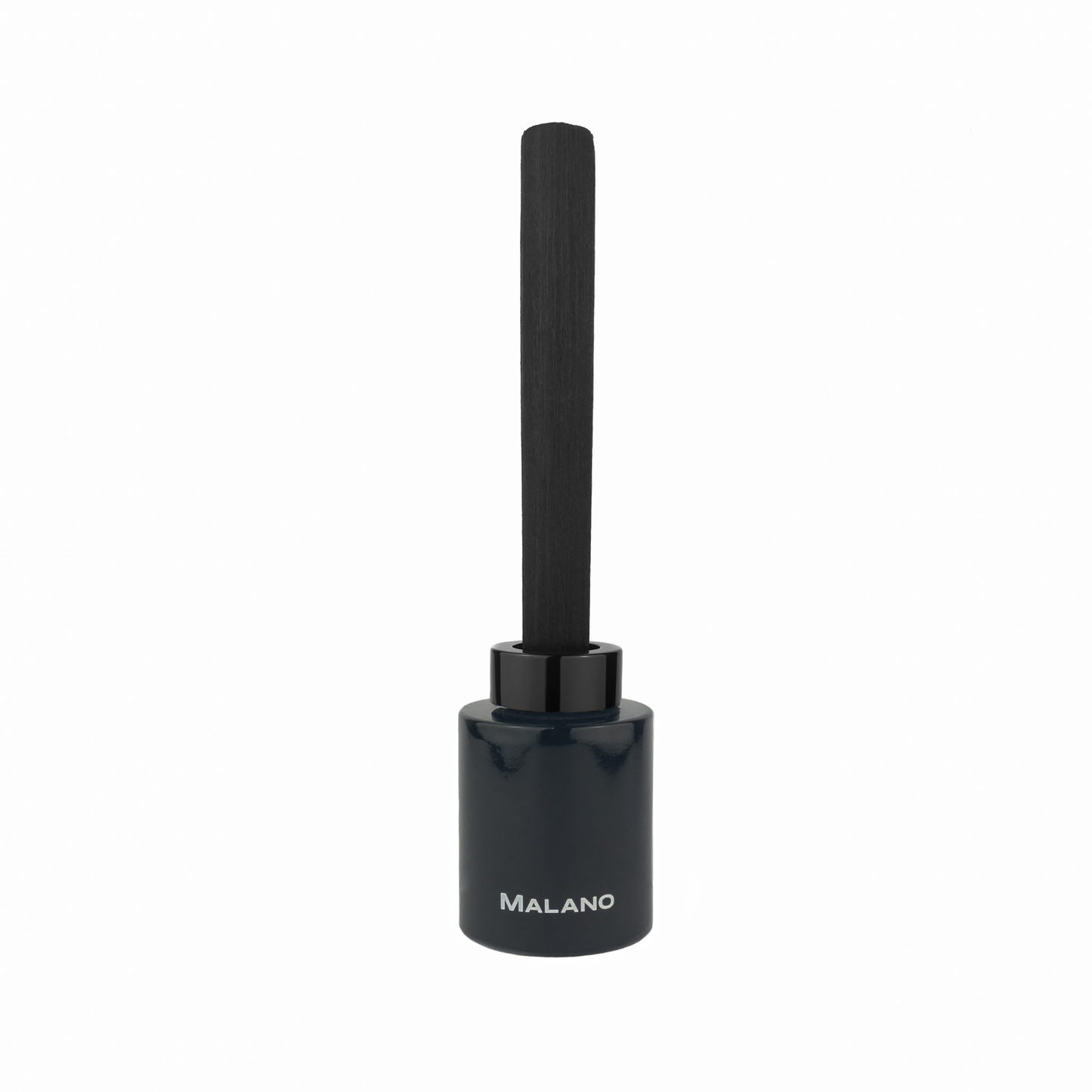 A black reed diffuser with 1 ultra thick long reed inserted into a black cylindrical glass container with a label of the brand ‘Malano’ on the front.
