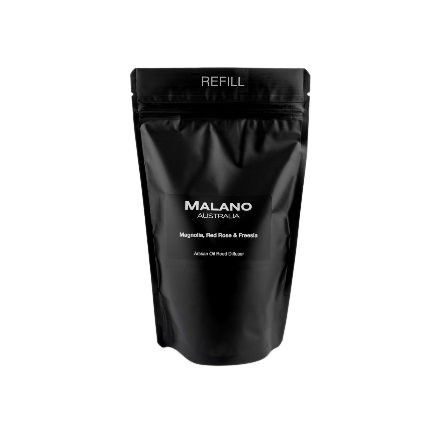 A black refill bag with the brand ‘MALANO’ and the scent reading ‘Magnolia, Red Rose and Freesia’,  ‘Artisan Oil Reed Diffuser’ and ‘ REFILL’ on the front.