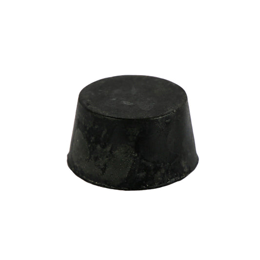 A round, black colored soap block with a smooth surface and infused with guinness, activated charcoal and patchouli.