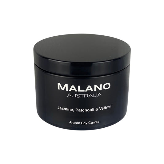 Luxury Australian handmade soy candle made by Malano in matte black jar, with a beautifully balanced, vibrant and sophisticated, citrus/floral scent ofJasmine, Patchouli and Vetiver. The tin is sitting against white background