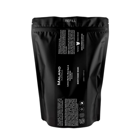 A black refill bag  labeled 'Malano Body/Hand Wash with the scent of Lemon Myrtle, Blue Gum and Lemongrass, sitting against a white background.