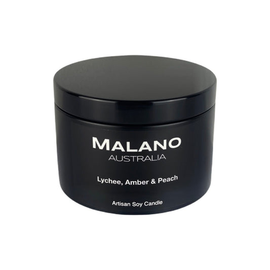 Malano scented artisan soy candle in black matte tin  with lid, hand-poured with a fruity Lychee, Amber and Peach fragrance.