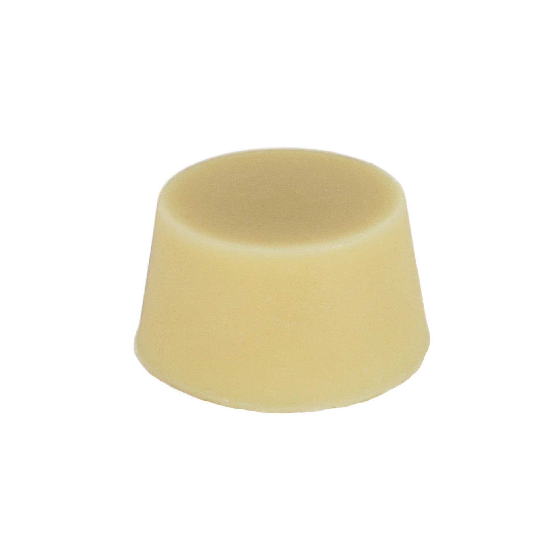 A solid cream coloured oily hair organic conditioner bar made by Malano against a white background.