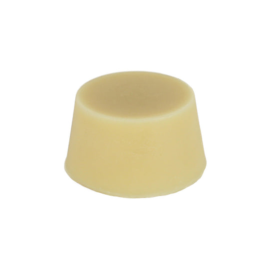 A solid cream coloured oily hair organic conditioner bar made by Malano against a white background.