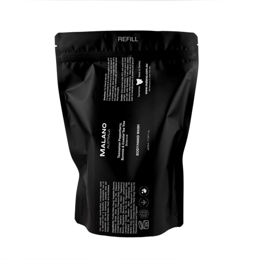 A black refill bag labeled 'Malano Body/Hand Wash with the scent of Tasmanian Pepperberry, Boronia and Costal Tea Tree, in 500mL, sitting against a white background.