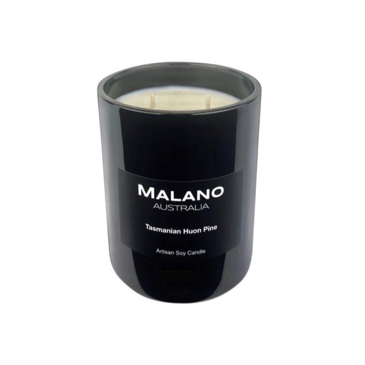 Black gloss glass jar containing a luxury Australian artisan  hand poured  scented soy wax candle by Malano with a woody, fougère scent of Tasmanian Huon Pine,  sitting against a white background