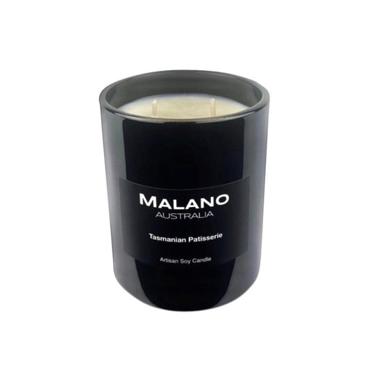 Black gloss glass jar containing a luxury Australian artisan, hand poured, scented soy wax candle by Malano with a Gourmand scent of Tasmanian Patisserie  against a white background