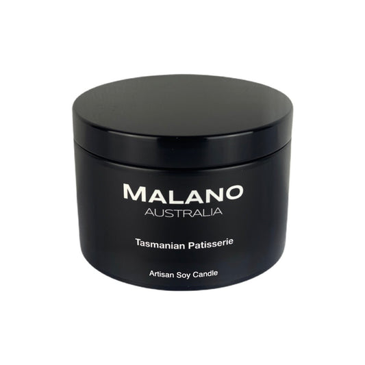 Black matte tin  containing a luxury Australian artisan, hand poured, scented soy wax candle by Malano with a Gourmand scent of Tasmanian Patisserie  against a white background
