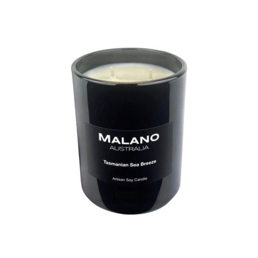 Black gloss glass jar containing a luxury Australian artisan hand poured and scented soy wax candle with two wicks by Malano with a citrus marine scent of Tasmanian Sea Breeze,  sitting against a white background